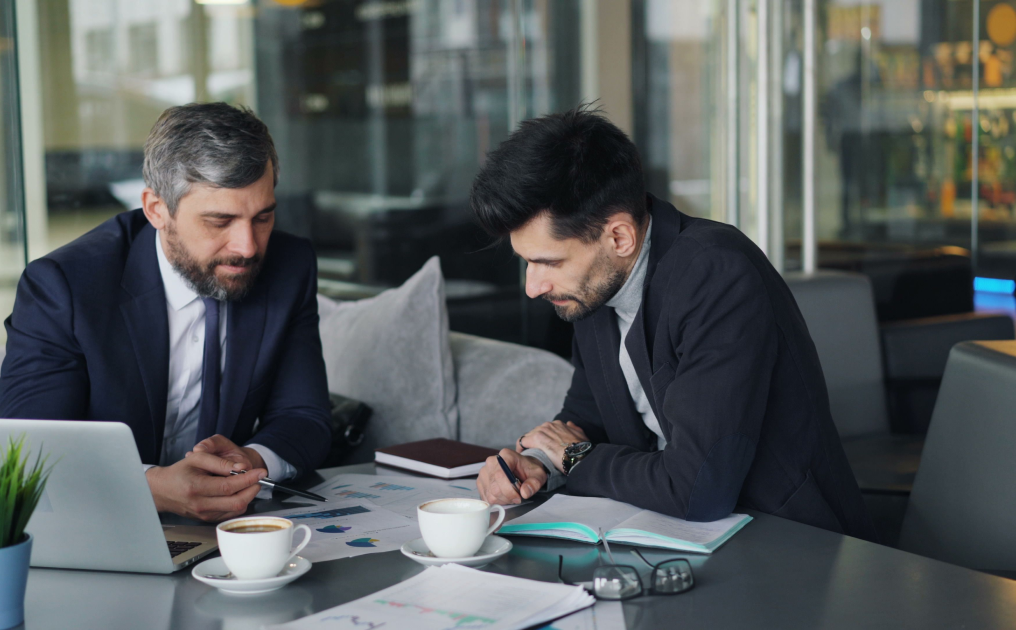 Business advisors reviewing documents
